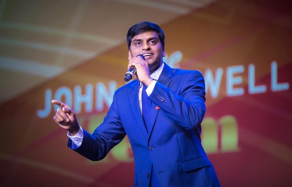 Dr. Shivakumar Basavanahally speaking on stage